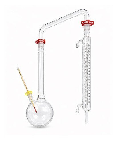 Alambique de laboratorio en vidrio borosilicato con juntas esmeriladas 29/32, refrigerante de serpentín y termómetro químico.